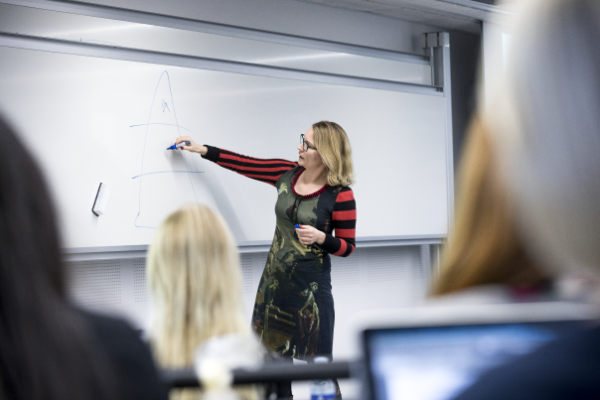 Illustration showing a teacher in a classroom